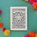 A cream and silver coloured laser cut card for baby first Christmas.