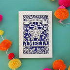 A Happy first Christmas laser cut card with a star and floral border. Card is personalised with baby's name