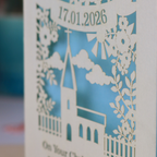 A laser cut floral Christening card with cut out church design and the date in a stencil font in a banner, with "On Your Christening Day" and the name "Maggie Jayne Chilton" underneath.