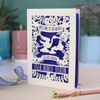 A personalised new baby card with laser cut floral stork design and "Welcome to the World" in cut out text in a banner, with the baby's date of birth and name