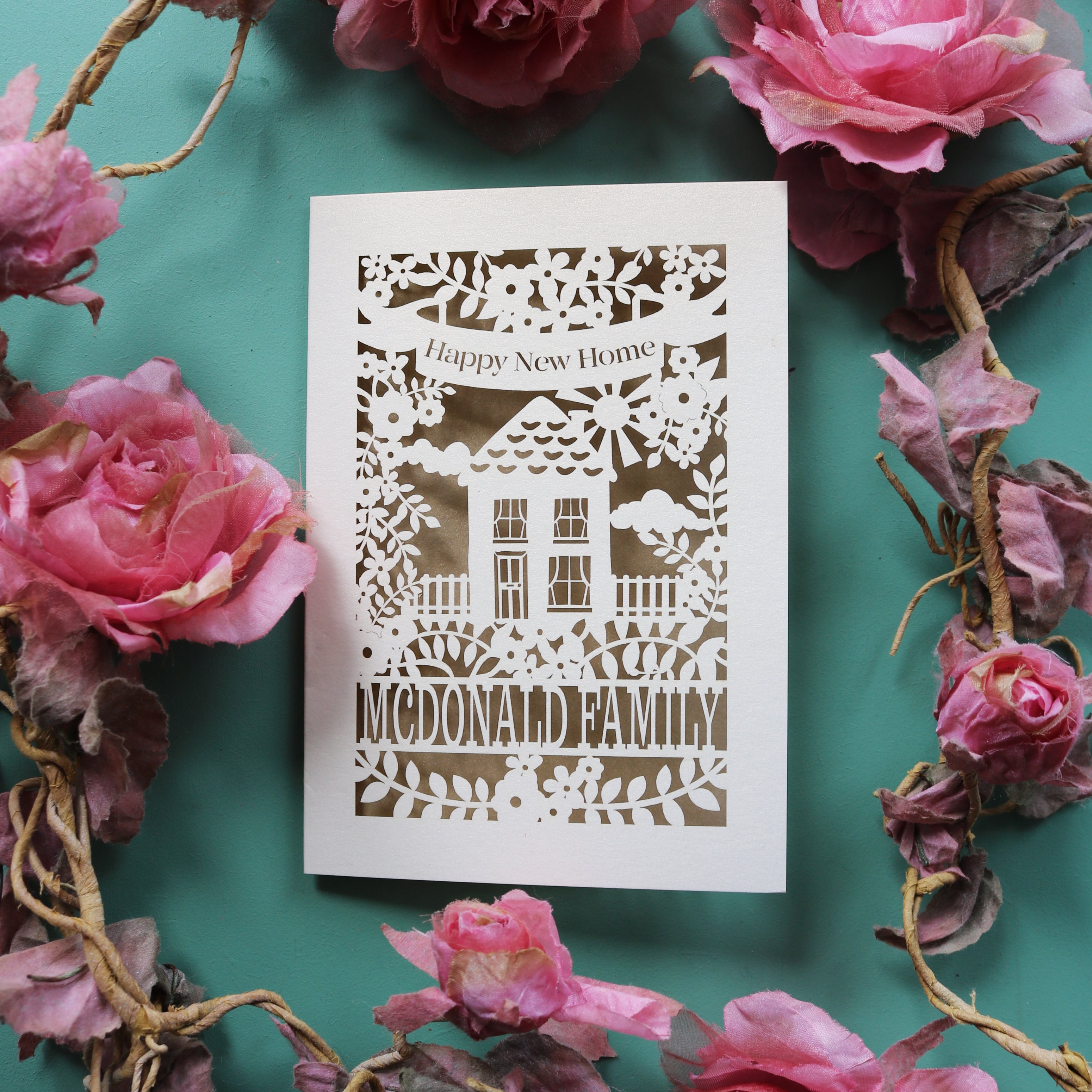 A unusual new home card, made in the UK. Card says "Happy new home" and is personalised with the recipient/s' name in a line of text