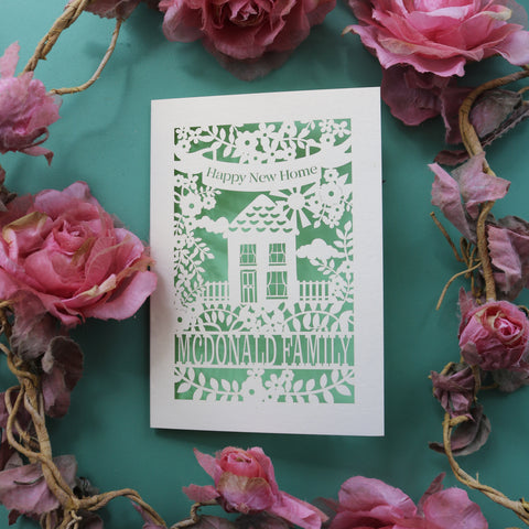 A new how card, made in the UK. Card says "Happy new home" and is personalised with the recipient/s' name in a line of text - A6 / Light Green