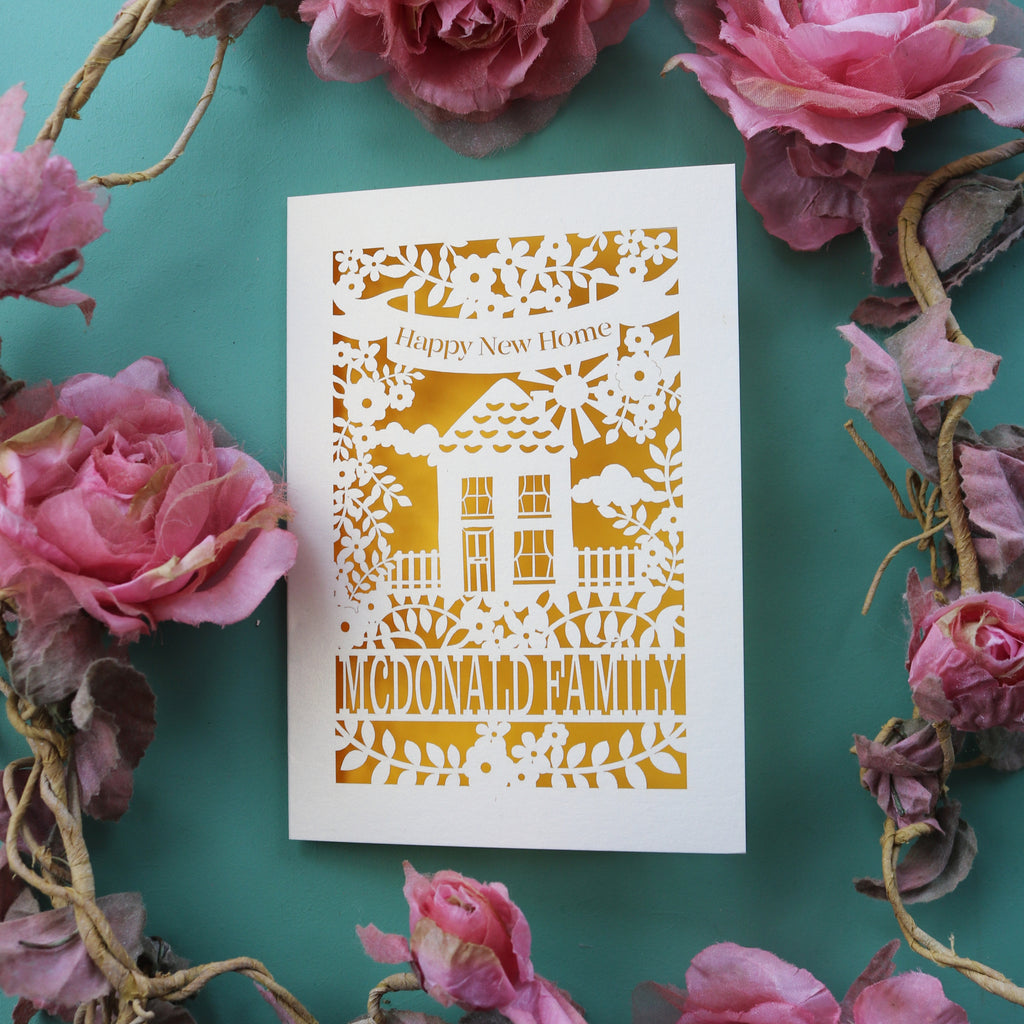 A sweet new home card for families. Card says "Happy new home" and is personalised with the recipient/s' name in a line of text