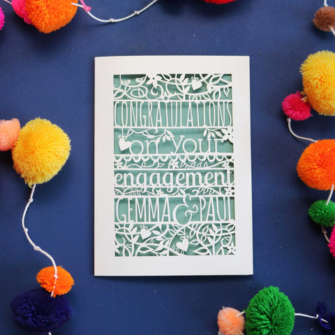 Laser cut cards from the UK. This image shows a cut out card with "congratulations on your engagement Gemma & Paul".  - A5 / Cream / Sage