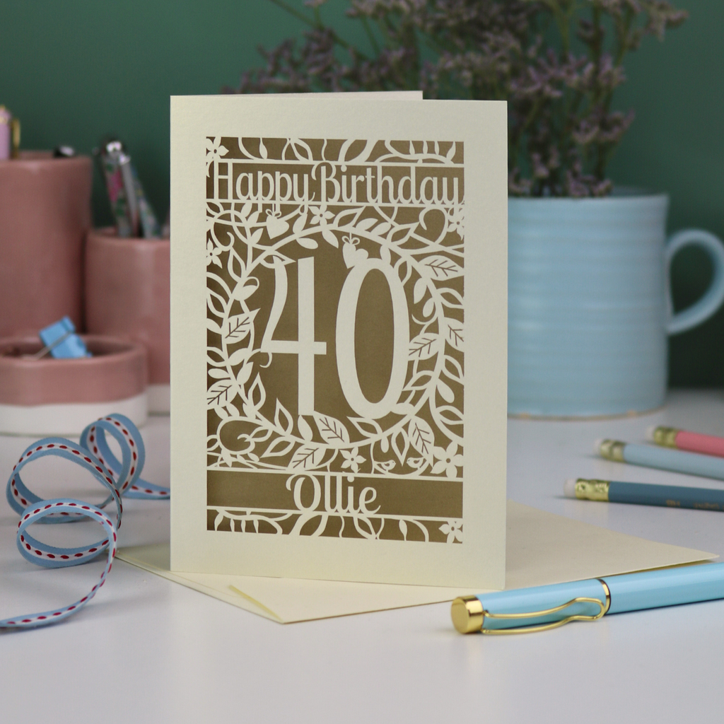 A laser cut floral 40th birthday card, personalised with the age 40 and the name. 