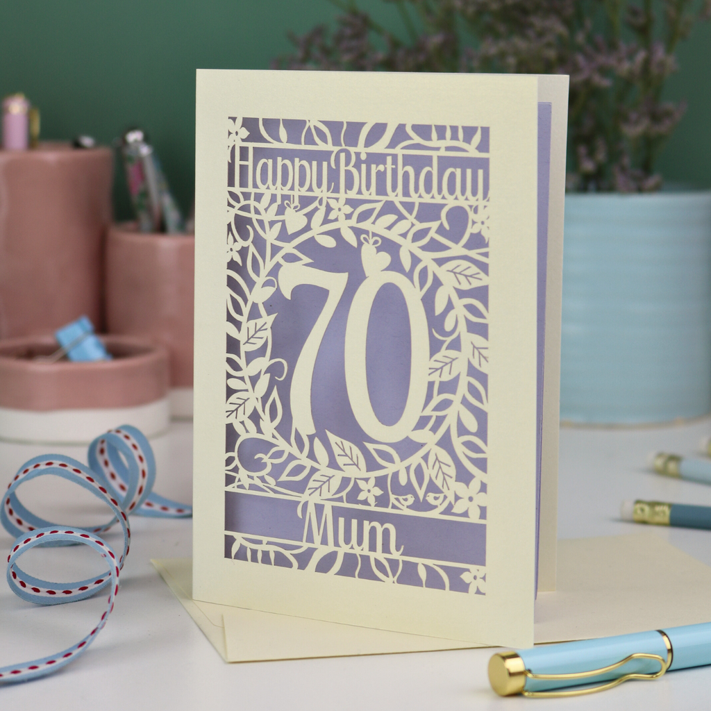 A personalised 70th birthday card, laser cut with floral design and 'Happy Birthday', with a name at the bottom and a big number 70 in the centre. 