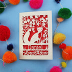 Decorative fox birthday card with fox design and colourful pom-poms on a blue background