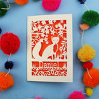 Decorative fox birthday card with fox design and colourful pom-poms on a blue background
