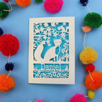 Decorative fox birthday card with fox design and colourful pom-poms on a blue background