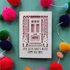 A laser cut new home card featuring a front door
