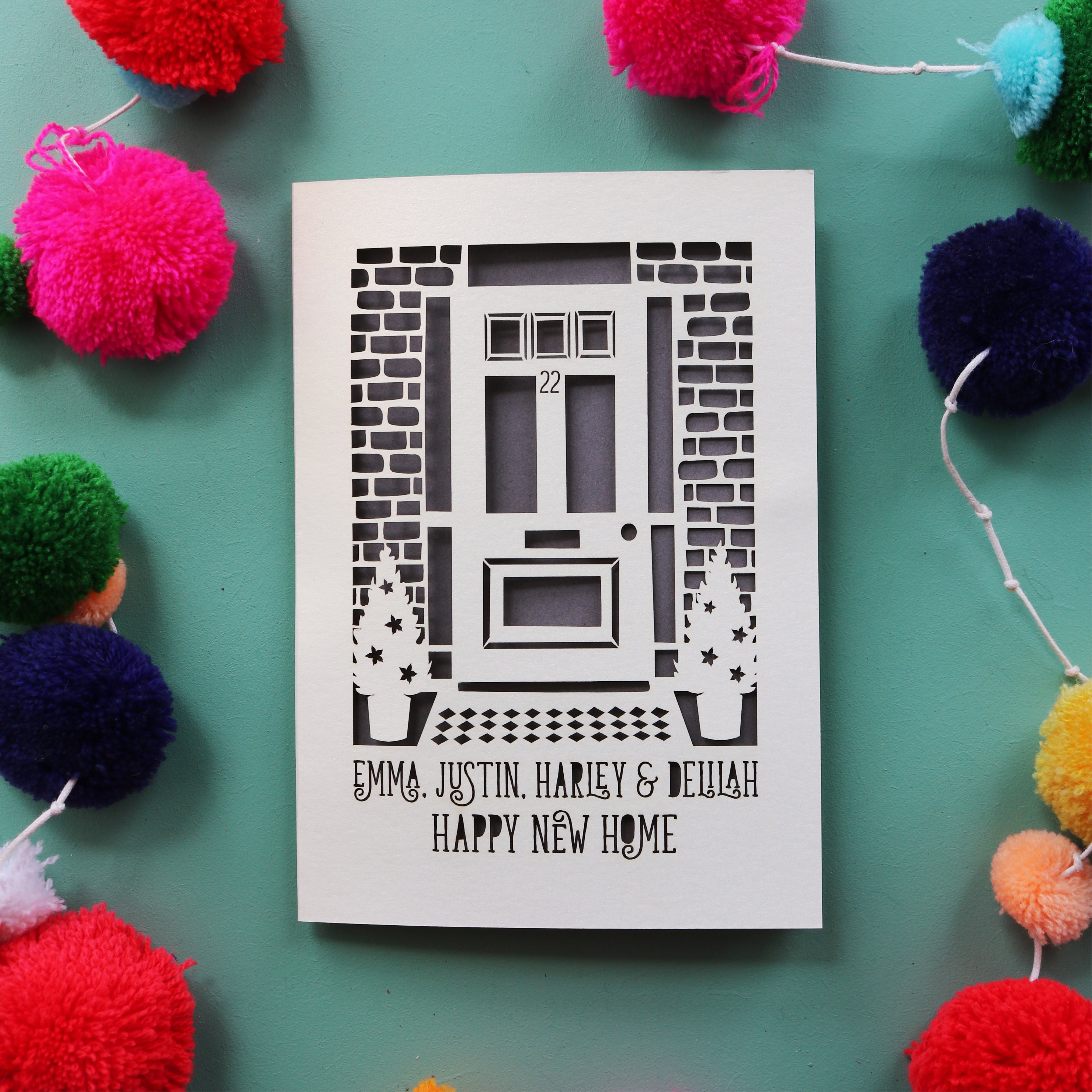 A happy new home card with a laser cut front door