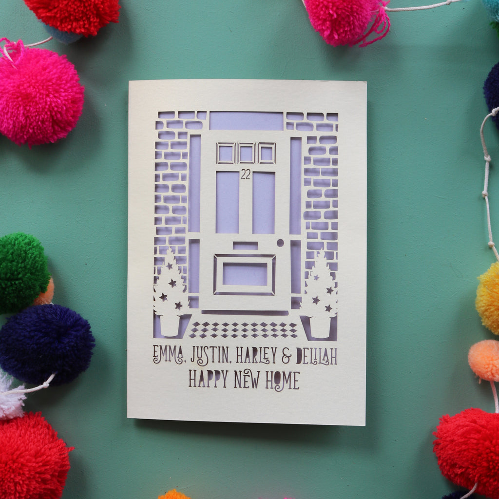 A cut out home card with front door and text