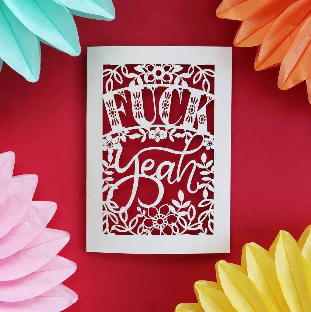 A Paper cut congratulations card that says "Fuck Yeah"