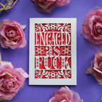 Paper Cut engagement cards that say "Engaged As Fuck"
