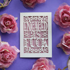 A cream and dusky pink engagement card with "Engaged as Fuck" in cut out text