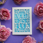 A Sweary engagement card that says "Engaged as fuck" in laser cut text