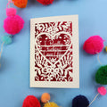 Funny Valentine's Card with floral design and text on a blue background with colourful pom-poms