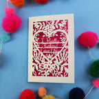 Sweary Valentine's Card with floral design and text on a blue background with colourful pom-poms