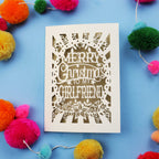 Christmas card with 'Merry Christmas to my girlfriend' text on a blue background with colourful pom-poms.