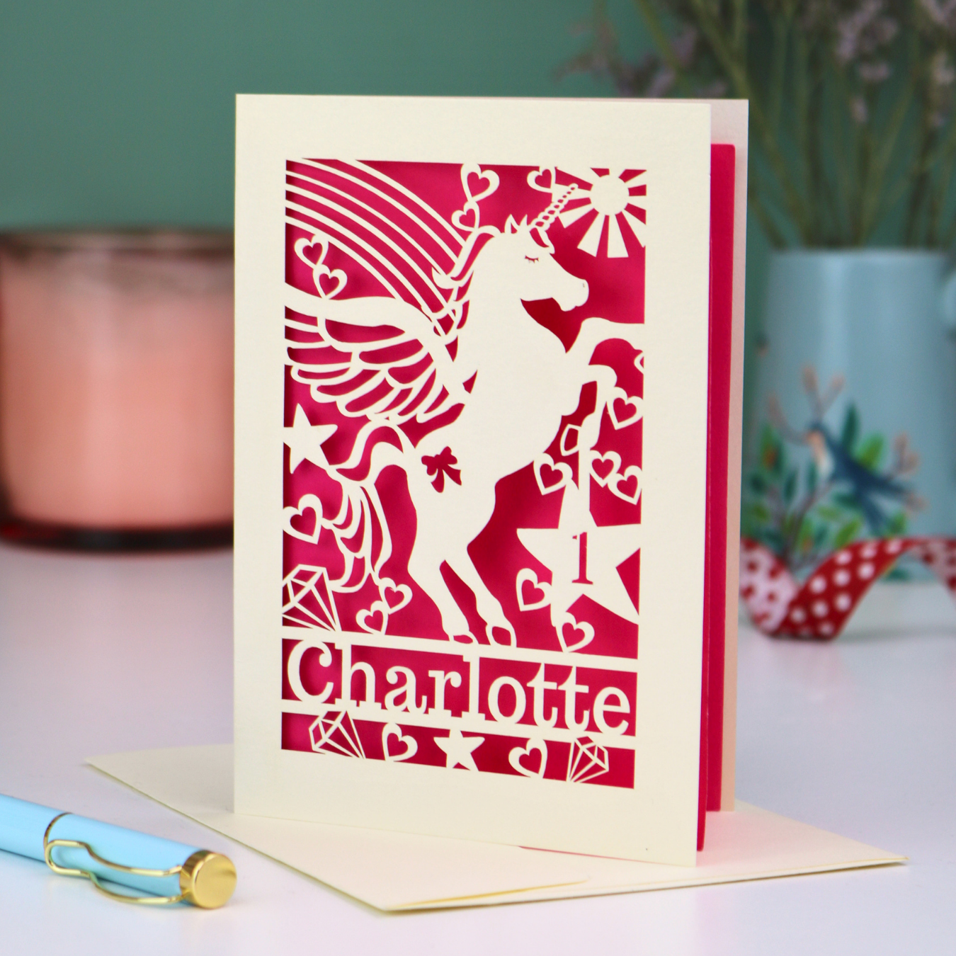 A laser cut girls' birthday card with unicorn design, personalised with an age and name