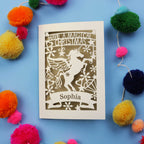A personalised laser cut girls' Christmas card with a unicorn and the words "Have a magical Christmas, Name"