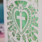 Personalised laser cut Baptism day card with decorative design and text on a wooden surface.
