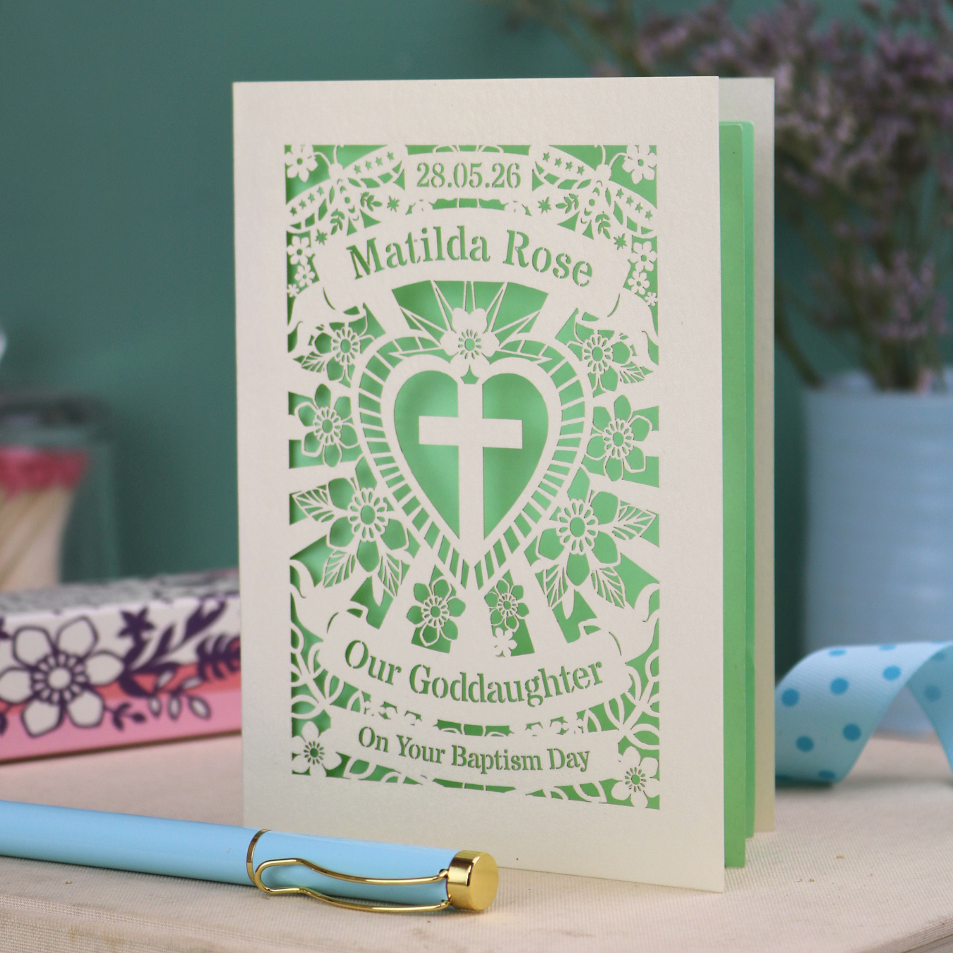 Personalised laser cut Baptism day card  from Godmother with decorative design and text on a wooden surface.