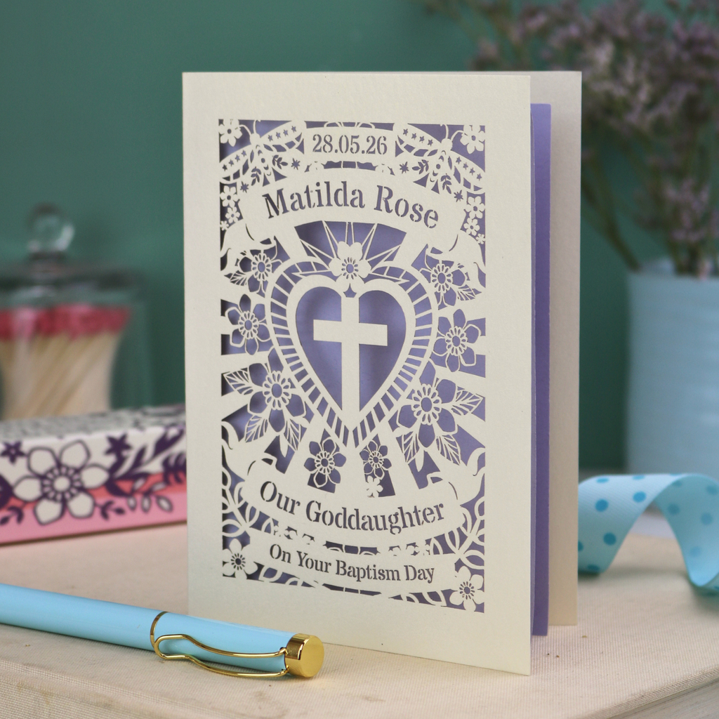 Personalised laser cut Goddaughter card with decorative design and text on a wooden surface.
