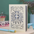 Personalised laser cut God Daughter Baptism day card with decorative design and text on a wooden surface.