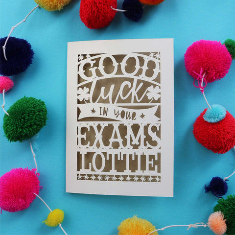 A paper cut card that says "Good luck in your exams" and is personalised with a name - A5 / Gold Leaf