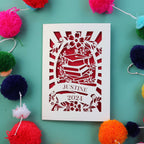 A cream and dark red card for graduation, personalised with a name and year