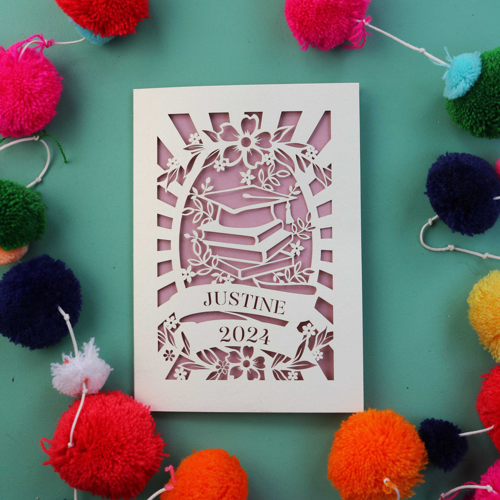 A card for son or daughter's graduation. Personalised with a name and year, this card is laser cut and hand finished
