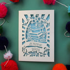 A graduation cap and books card, personalised with recipient's name and year