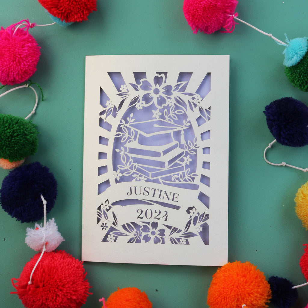 A cream and lilac graduation card from UK
