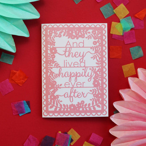 A wedding card that says "and they lived happily ever after" - 