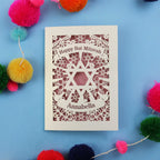 Bat Mitzvah card with decorative elements on a blue background