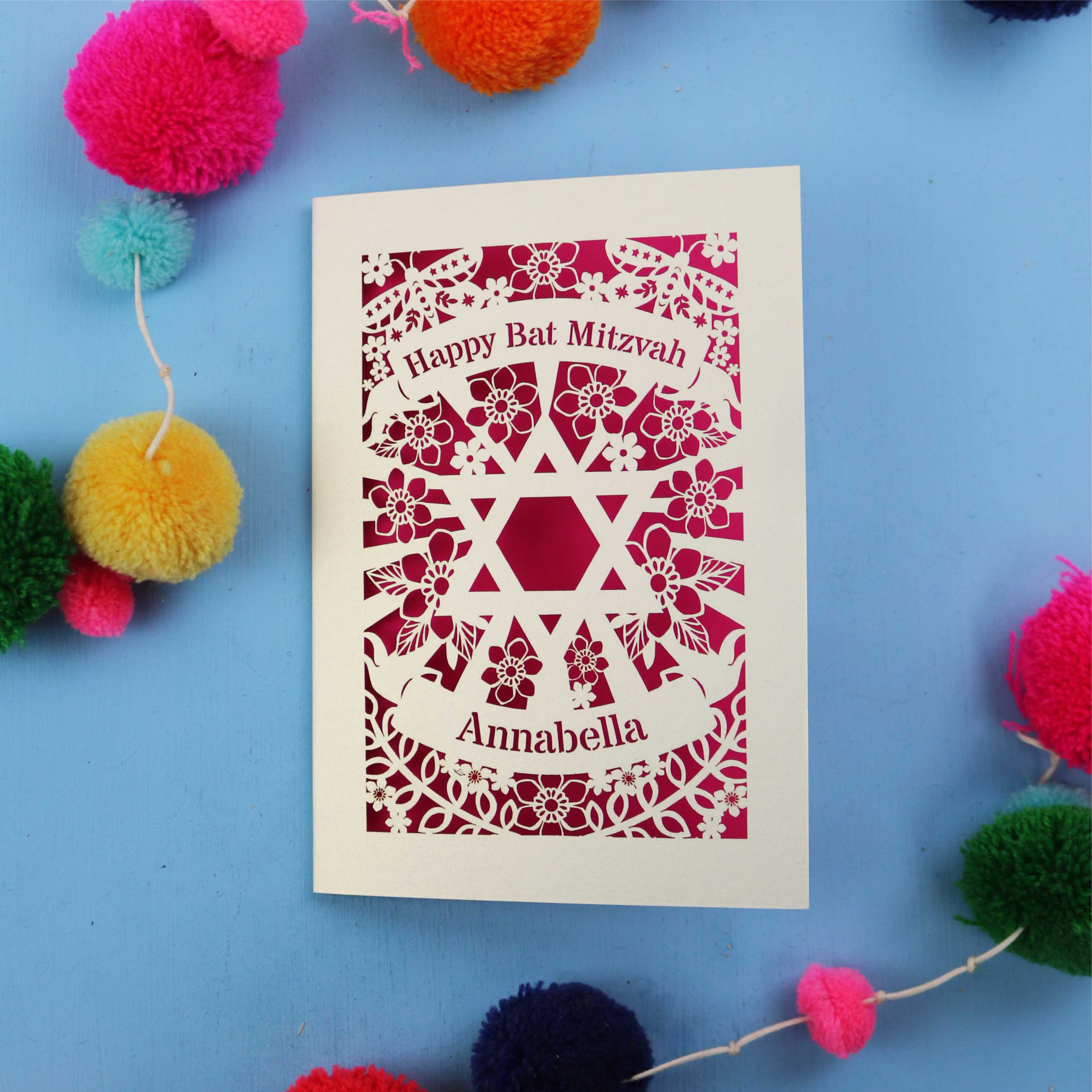 Bat Mitzvah card with decorative elements on a blue background