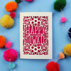 Laser Cut Diwali Card with 'Happy Diwali' design surrounded by colourful pom-poms on a blue background