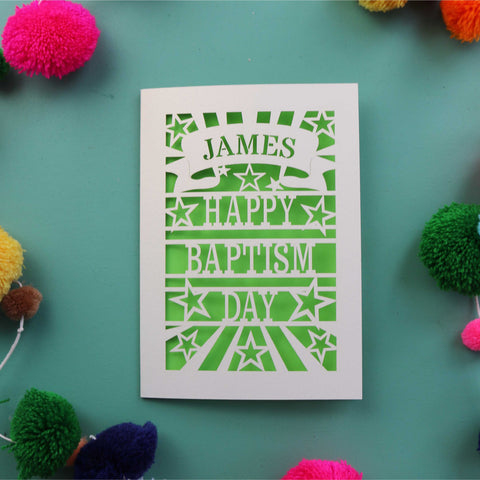 A paper cut Baptism card that is personalised with a first name in a banner and reads "Happy Baptism Day" - A5 / Bright Green