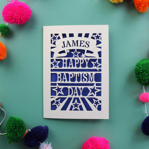 A laser cut Baptism card that is personalised with a first name in a banner and reads "Happy Baptism Day" - A5 / Infra Violet