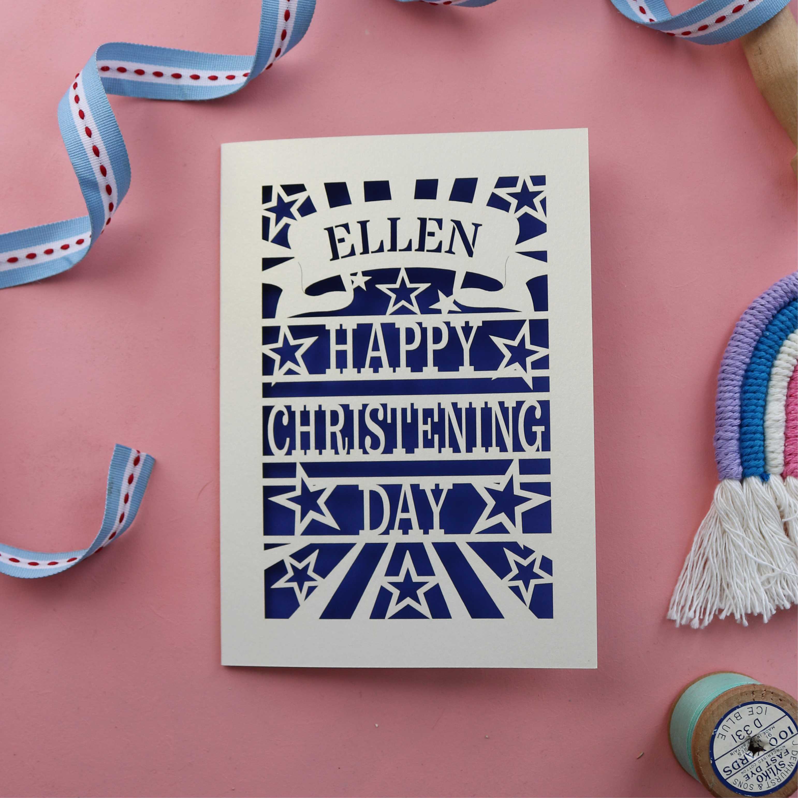 A cut out card for a Christening day