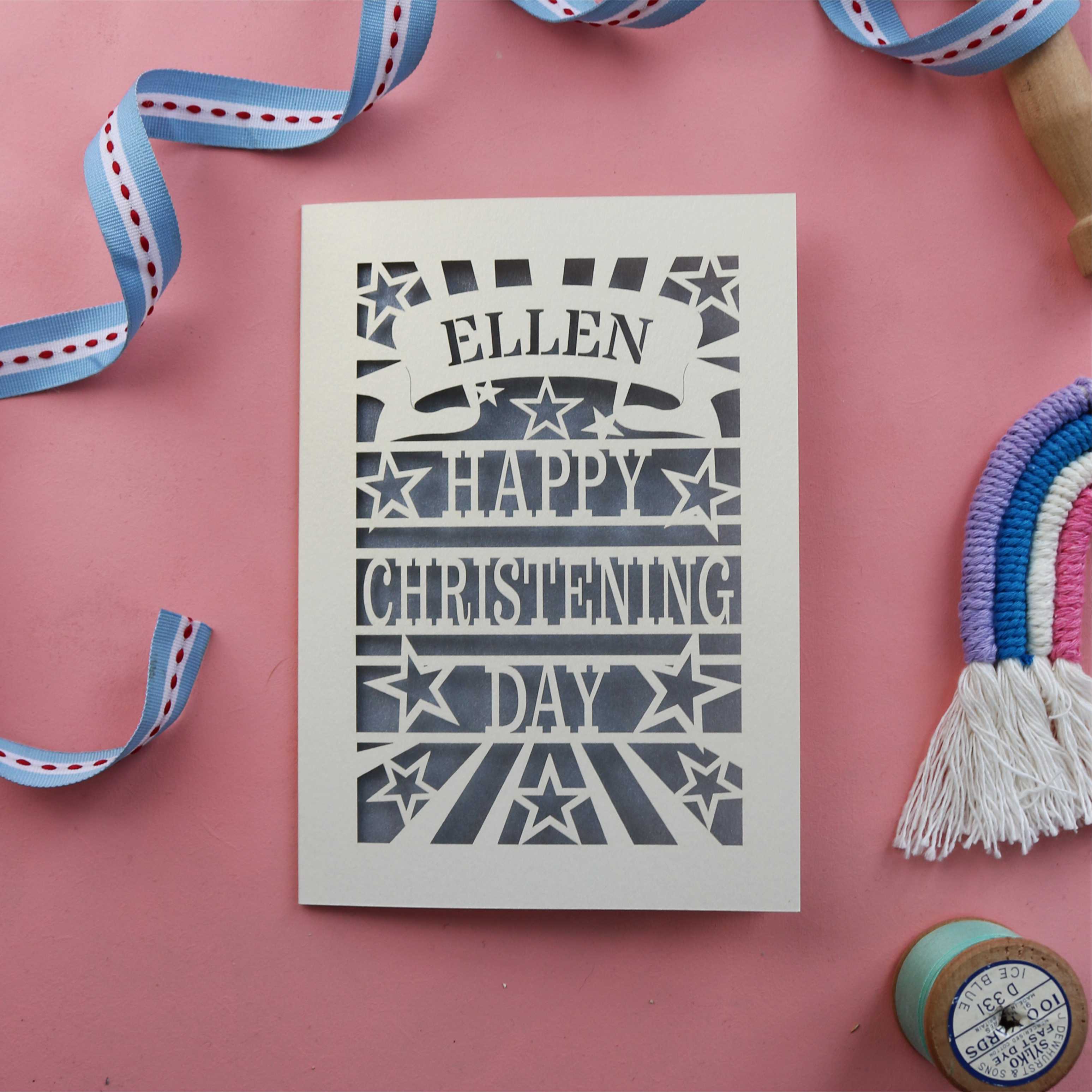 A laser cut Christening card personalised with a first name and hand finished with a paper insert
