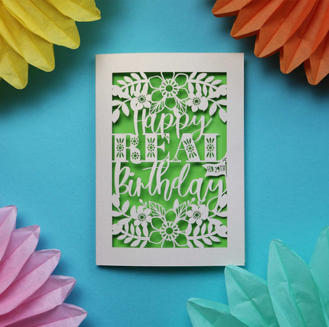 A papercut leap year birthday card that says "Happy Real Birthday"