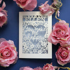 A personalised laser cut Valentine's Card that says "Name, You make me happy."