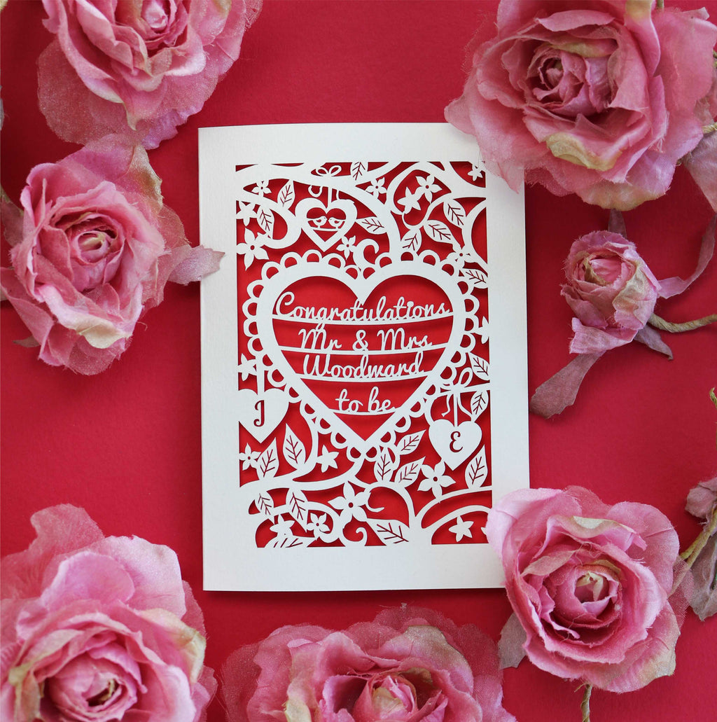 A laser cut card for engagements. Card says Congratulations Mr and Mrs Woodward to be