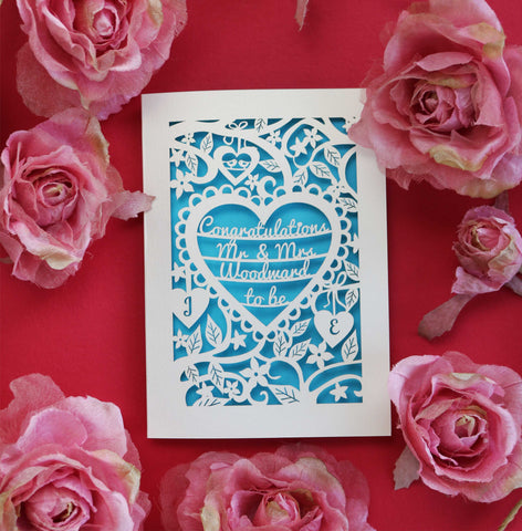 A personalised engagement card, laser cut with a blue paper insert behind - A5 / Peacock Blue