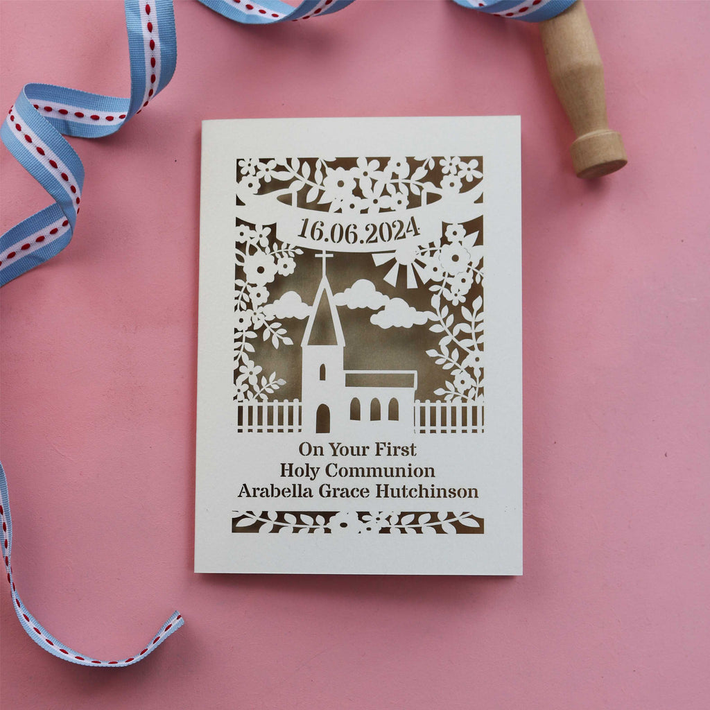 A laser cut personalised First Holy Communion card