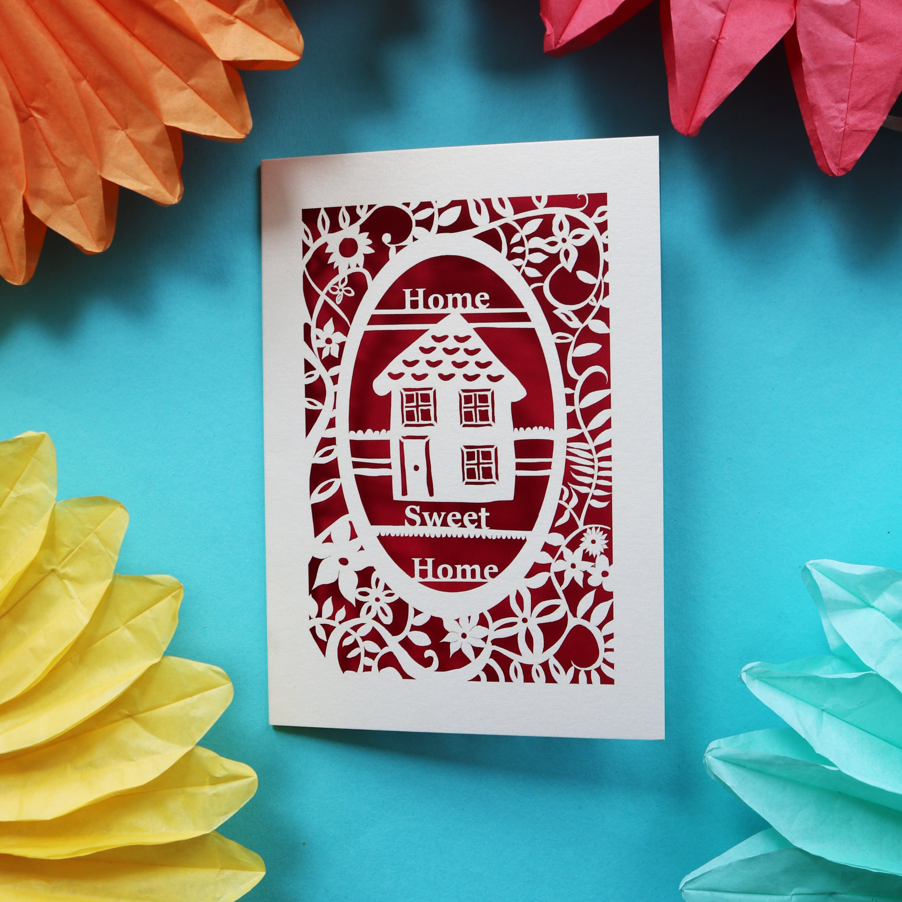 A card for house buyers that has a laser cut house and the words "Home sweet home"