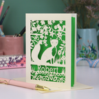 Husband Birthday Card with fox design and 'Robert' text on a desk with stationery items.