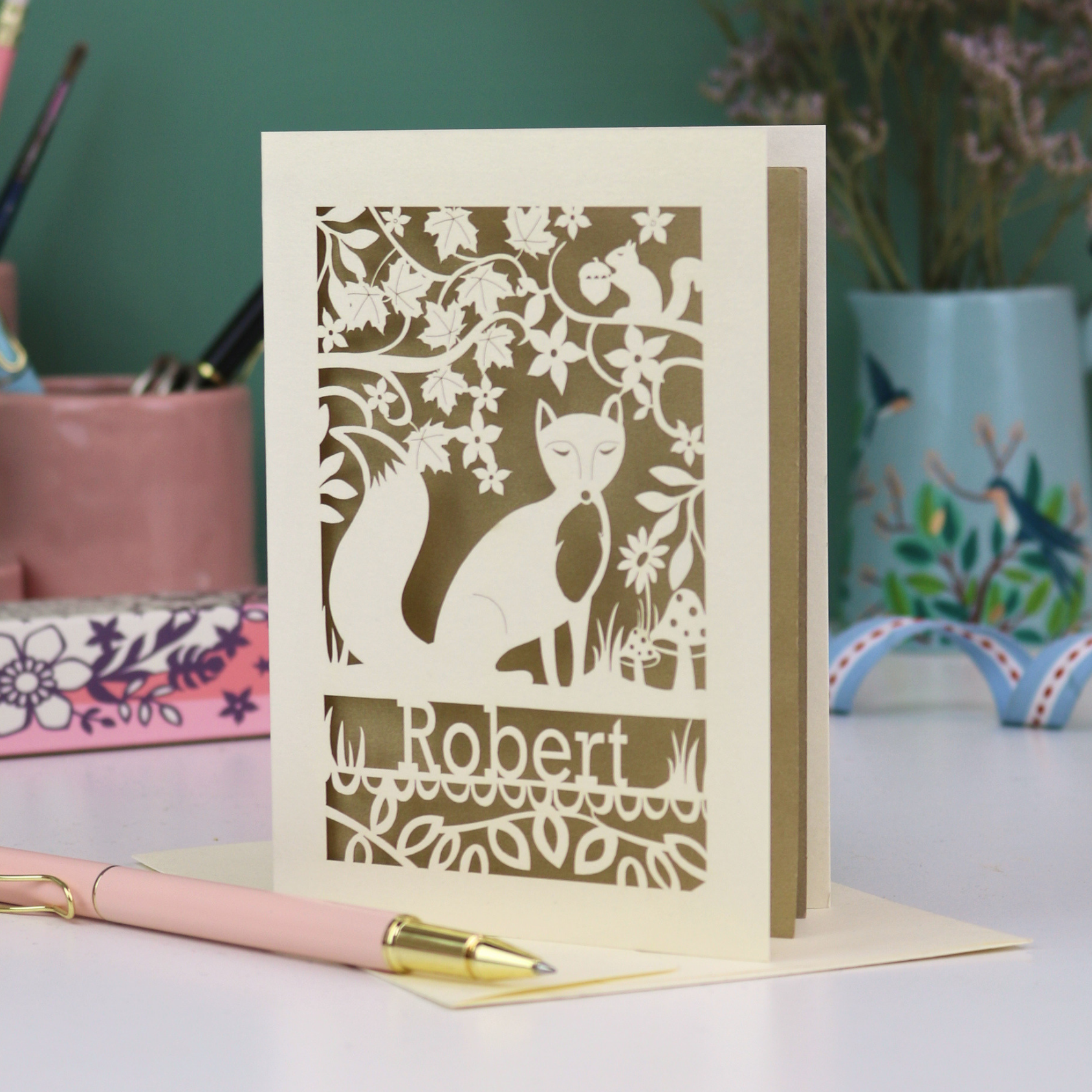 A laser cut birthday card for a husband, with fox cut out design and personalised with his name underneath. 